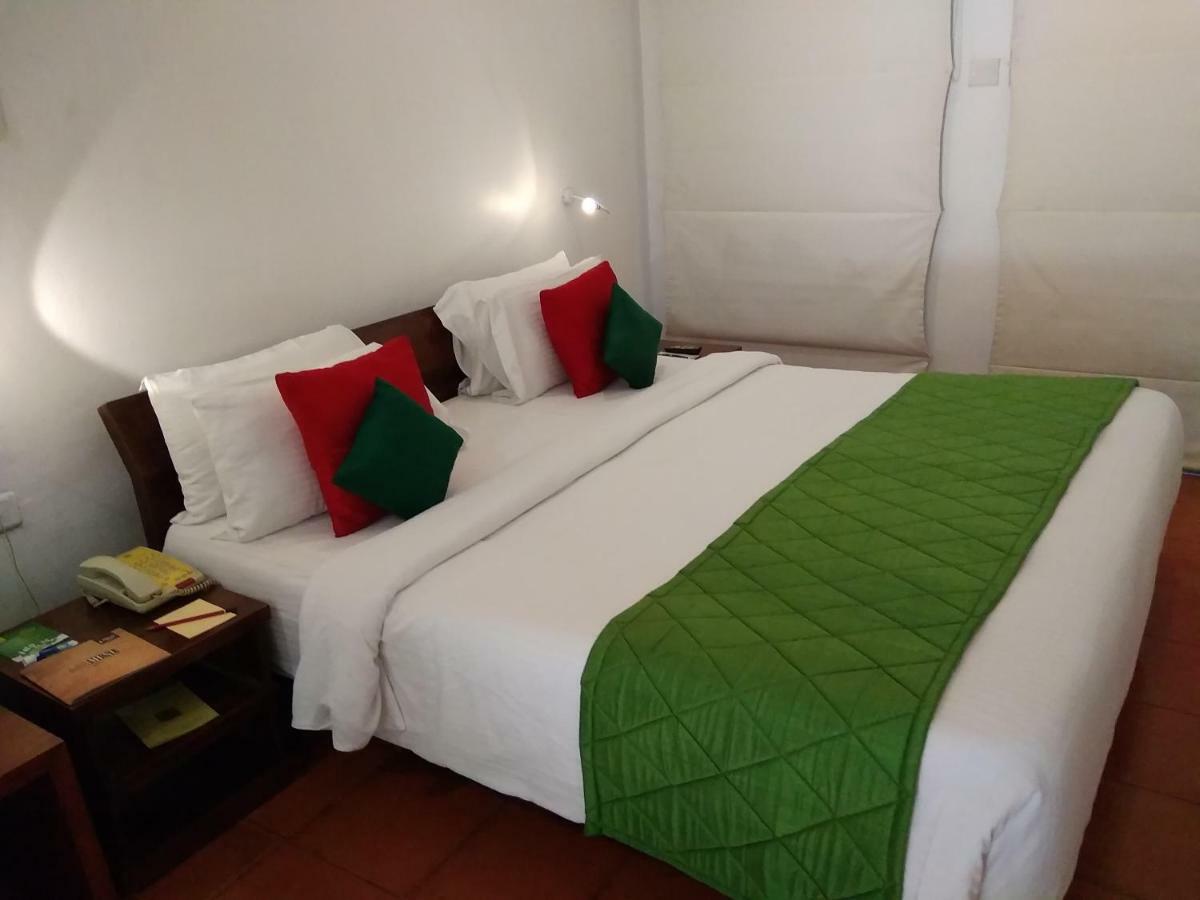 Heritage Madurai Bagian luar foto A bed